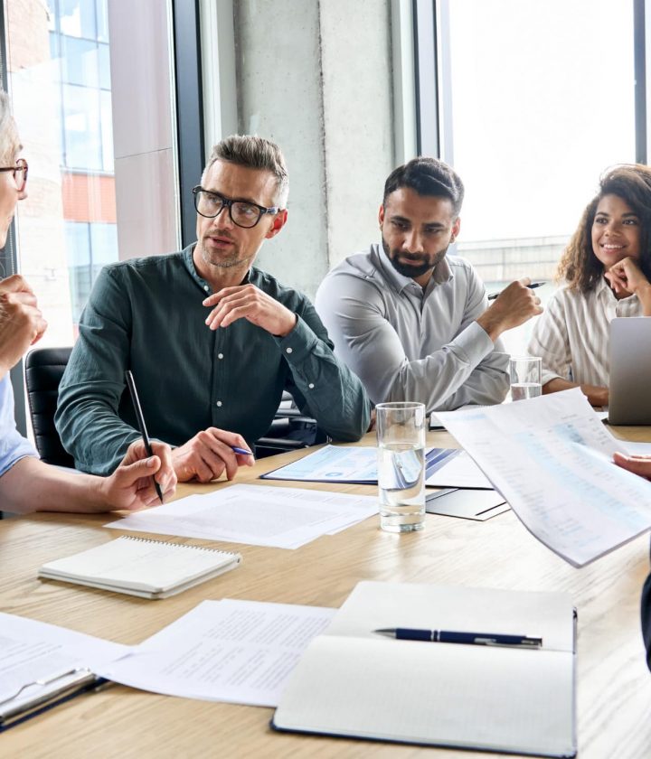 business meeting - diverse team around a table